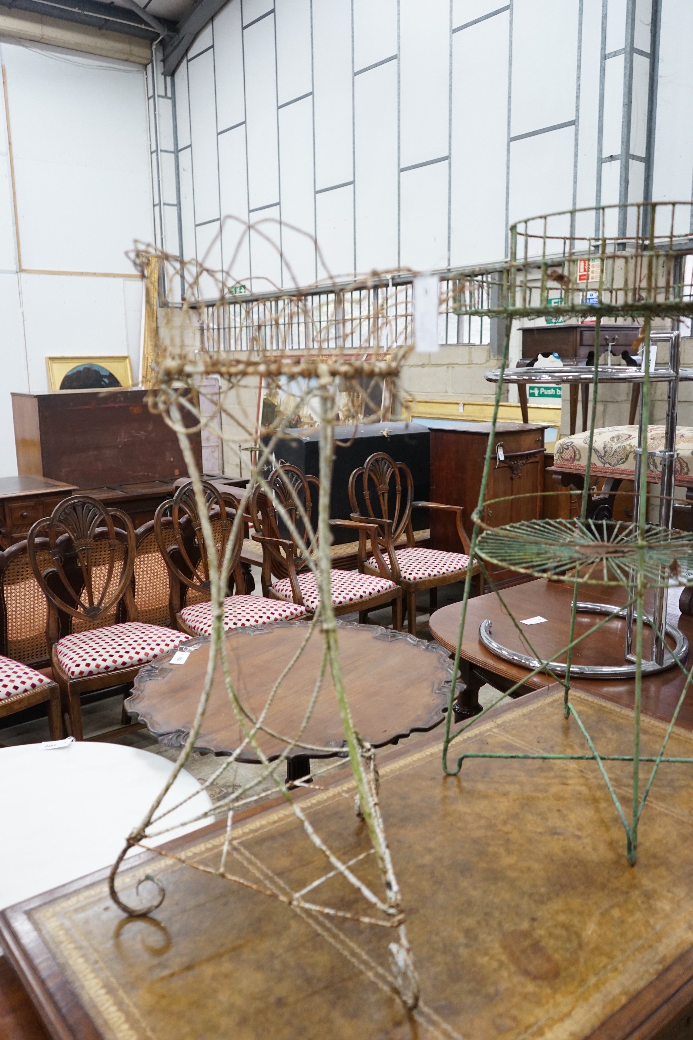 Two Victorian painted wirework pot stands, larger height 90cm